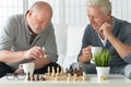 Senior men playing chess