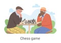 Two senior men relaxing over a game of chess outdoors