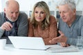 Two senior men and woman sitting at table Royalty Free Stock Photo