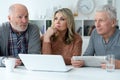 two senior men and woman sitting at table Royalty Free Stock Photo