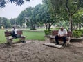 Two senior person of India looking busy in the beautiful park of India Royalty Free Stock Photo