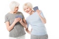 Two senior smiling sportswomen playing cards