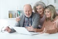 Two Senior women and man using laptop Royalty Free Stock Photo