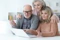 Two Senior women and man using laptop Royalty Free Stock Photo