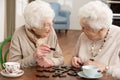 Two Senior Women Playing Dominoes Royalty Free Stock Photo