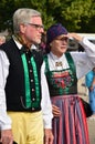 Two seniors in traditional folk costume