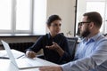 Two serious diverse employees discussing business project tasks Royalty Free Stock Photo