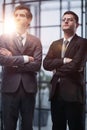 Two men business workers standing with arms crossed gesture at office Royalty Free Stock Photo