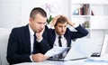 Business male assistants making mistake Royalty Free Stock Photo