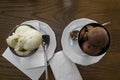 Two Servings Of Ice Cream In The Stainless Steel Bowls On The Wooden Table.T