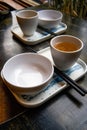 Two sets of Chinese-style tableware on the dining table, rice bowl, chopsticks and teacup Royalty Free Stock Photo