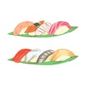 Two sets of nigiri sushi served on flat banana leaves. Sushi with fish and nori.