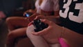 Two sexy girls playing tv game holding joysticks