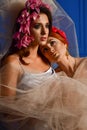 Portrait of the two gorgeous ladies with wild flowers. Elegance.  Wreaths  Fantasy Royalty Free Stock Photo