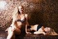 Two sexy young girls blonde swimsuits steamed in the sauna. Turkish bath Hamam. healthy lifestyle concept. spa treatments