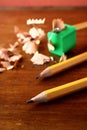 Two sharpened pencils and one in a pencil sharpener Royalty Free Stock Photo