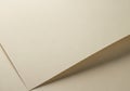 Two sheets of beige paper with a subtle texture, lying on a flat Royalty Free Stock Photo