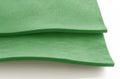 Two sheets of bright green spongy foam on a white background Royalty Free Stock Photo