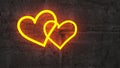 Two shining golden heart on rough concrete wall Royalty Free Stock Photo