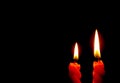 Two Shining Red Candles Isolated On the Dark Background Royalty Free Stock Photo