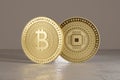 Two shiny golden bitcoins standing on metal floor as concept for financial technology and crypto-currency