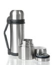 Two shiny metal thermos