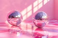 Two shiny pink disco balls are reflected in a pink background Royalty Free Stock Photo