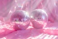 Two shiny pink disco balls are reflected in a pink background Royalty Free Stock Photo