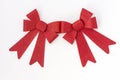 Two shiny red holiday bows