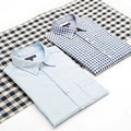 Two shirts are on a checkered surface isolated on transparent background Royalty Free Stock Photo