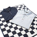 Two shirts on checkered surface isolated on white background Royalty Free Stock Photo