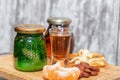 Two shot of home-brewed whiskey stand on a wooden board Royalty Free Stock Photo