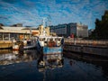 two shrimp boats moored on a pier on a city wharf in the morning Royalty Free Stock Photo