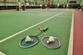 Two shuttlecocks on rackets in the badminton court Royalty Free Stock Photo