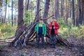 Two sibling brothers boys In the spring or autumn pine forest pl Royalty Free Stock Photo