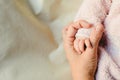 Two siblings, a baby and a toddler shaking hands. Royalty Free Stock Photo