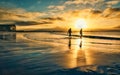 Two silhouetted people entering the Atlantic ocean at Silverstrand beach in Galway, Ireland Royalty Free Stock Photo