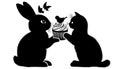 Two silhouettes of animals, a rabbit and a kitten, sit facing eac Royalty Free Stock Photo