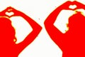 Two silhouettes of people in red making a love sign Royalty Free Stock Photo