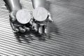 Two silver euro coins in futuristic robot hands