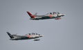 Two silver Fouga Magister jets flying at the Kaivopuisto Air Show