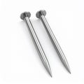 Two Silver Metal Nails on White Background Royalty Free Stock Photo