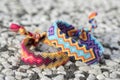 Two simple handmade homemade natural woven bracelets of friendship on stone background Royalty Free Stock Photo