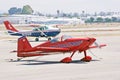 Two single engine aircraft parked on the tarmac at Zamperini Field