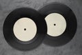 Two single vinyl records on black background Royalty Free Stock Photo