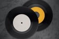 Two single vinyl records on black background Royalty Free Stock Photo