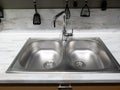 Two sinks and a faucet in the kitchen Royalty Free Stock Photo