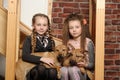 Two sister girls with puppies Royalty Free Stock Photo