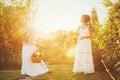 Two sisters and a basket of harvest