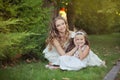 Two sisters blond chestnut blue eyes lady girls posing together summer sunny day evening dressed in white airy dinner party formal